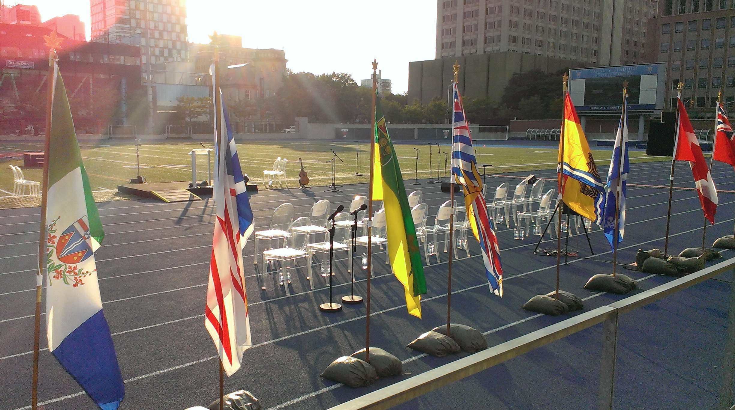 At the “In Memoriam” event , July 31st 2014: the speakers’ platform, seating for distinguished guests, and flags of Canada, its provinces, and territories.