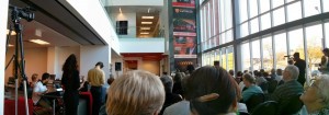 A big crowd of folks who care enough about libraries to spend a beautiful Sunday afternoon in a university building lobby.