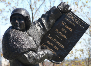 Nellie McClung from the monument on Parliament Hill, showing historic newspaper headlines from the Persons Case. Photo: “Les Girls” – The Famous Five 10 by Douglas Sprott, CC BY NC 2.0.