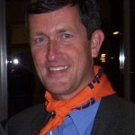 Sven Robinson with orange NDP bandanna around his neck.