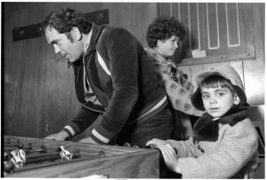 Three generations of Portuguese-Canadians at Tivoli Billiards Hall, on Augusta Ave., Kensington Market, 1980. Photo by Gilberto Prioste.