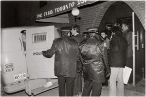 Figure 1: Men from the bathhouse raids being arrested. Source: Jamie Bradburn, “Bathhouse Raids Enrage Gay Community,” Citiesintime.ca http://citiesintime.ca/media/toronto/downtown/bathhouse-ra/bathhouse-photo-then_sm.jpg (accessed June 2, 2015).