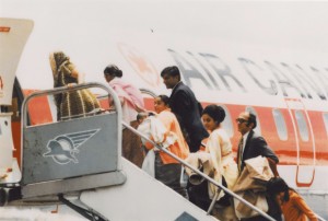 Ugandan Asian refugees board a plane for Canada, 1972. NHQ/AC Roger St. Vincent Collection PH-437.
