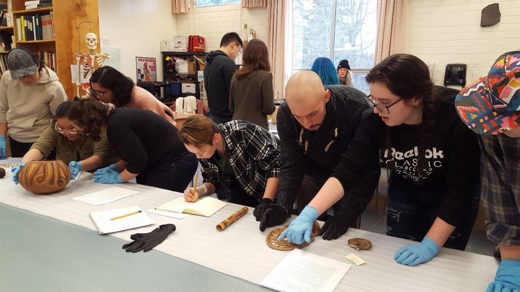 Students working with artifacts
