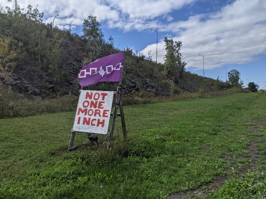 Sign reading Not One More Inch