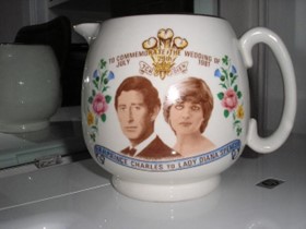 Porcelain jug with pictures of Prince Charles and Princess Diana on it.