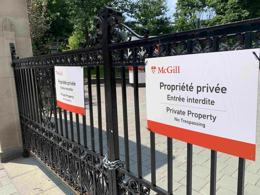 Signs on McGill's front gates declare "Private Property. No trespassing."