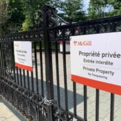 Signs on McGill's front gates declare "Private Property. No trespassing."